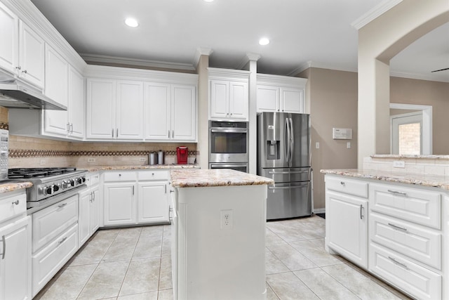416 Bronco Cir, Shady Shores, TX 76208 - kitchen with stainless steel appliances, tasteful backsplash, a center island, white cabinetry, and recessed lighting