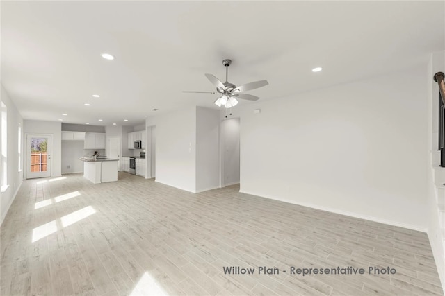 3116 Yellow Pne, Melissa, TX 75454 - unfurnished living room featuring baseboards, ceiling fan, light wood finished floors, and recessed lighting