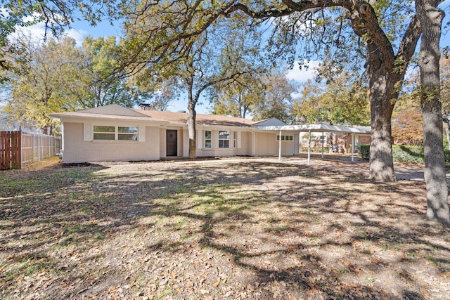 1409 Milner Rd, Irving, TX 75061 - view of front of property featuring a carport, brick siding, and a chimney