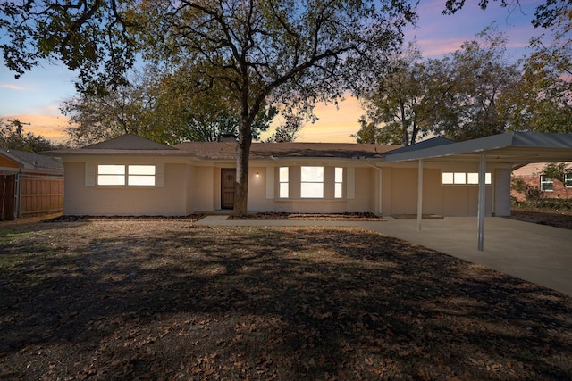 1409 Milner Rd, Irving, TX 75061 - single story home with a carport, driveway, and brick siding