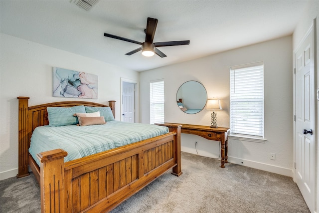 2208 Turtle Creek Dr, Sherman, TX 75092 - carpeted bedroom with multiple windows, baseboards, and a ceiling fan