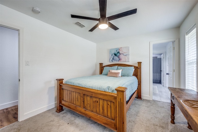 2208 Turtle Creek Dr, Sherman, TX 75092 - bedroom with baseboards, light carpet, a ceiling fan, and ensuite bathroom