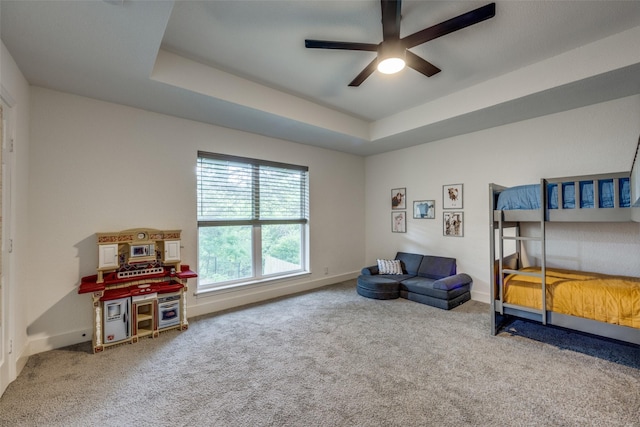 2208 Turtle Creek Dr, Sherman, TX 75092 - carpeted bedroom featuring a raised ceiling, baseboards, and a ceiling fan