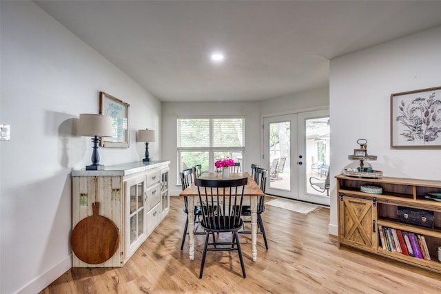 2208 Turtle Creek Dr, Sherman, TX 75092 - dining room featuring french doors, baseboards, and light wood-style floors