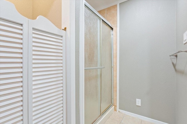 109 Hilltop St, Riesel, TX 76682 - full bathroom featuring a stall shower, tile patterned floors, and baseboards