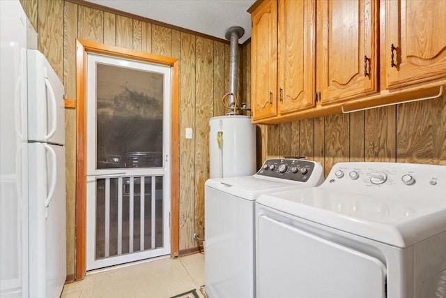 109 Hilltop St, Riesel, TX 76682 - laundry room featuring water heater, cabinet space, separate washer and dryer, and wooden walls
