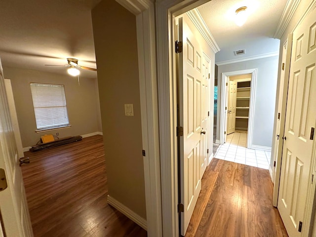 225 Jp Cave Rd, Sherman, TX 75090 - corridor with wood finished floors, baseboards, and ornamental molding
