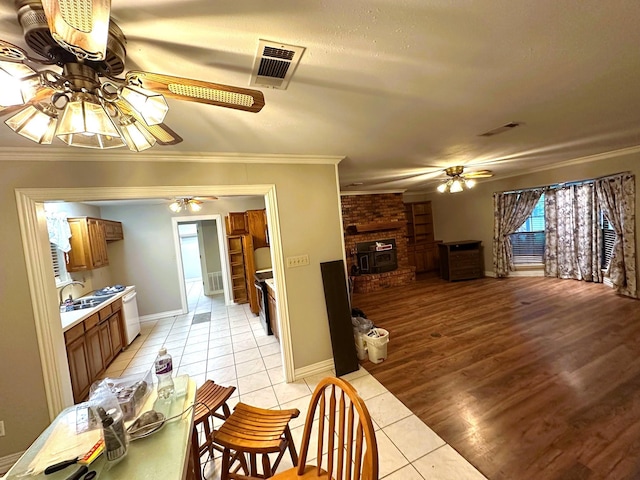 225 Jp Cave Rd, Sherman, TX 75090 - dining area with ceiling fan, light tile patterned floors, ornamental molding, and baseboards