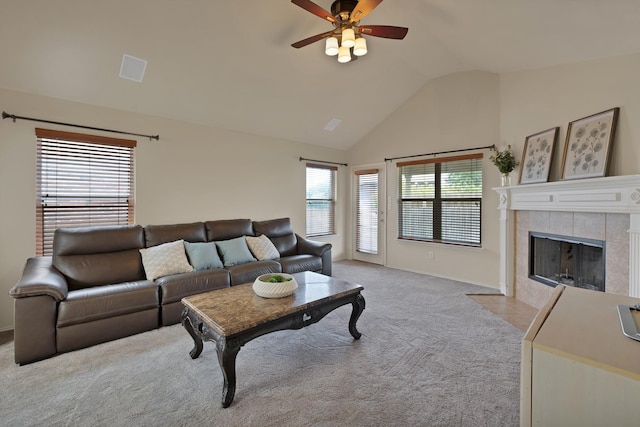 760 Red Elm Ln, Fort Worth, TX 76131 - living room featuring lofted ceiling, light colored carpet, ceiling fan, baseboards, and a tiled fireplace