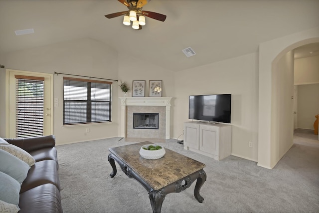 760 Red Elm Ln, Fort Worth, TX 76131 - living room with arched walkways, carpet flooring, lofted ceiling, a ceiling fan, and a fireplace