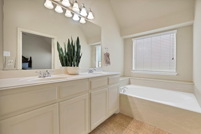 760 Red Elm Ln, Fort Worth, TX 76131 - bathroom featuring double vanity, a garden tub, tile patterned floors, ensuite bathroom, and vaulted ceiling