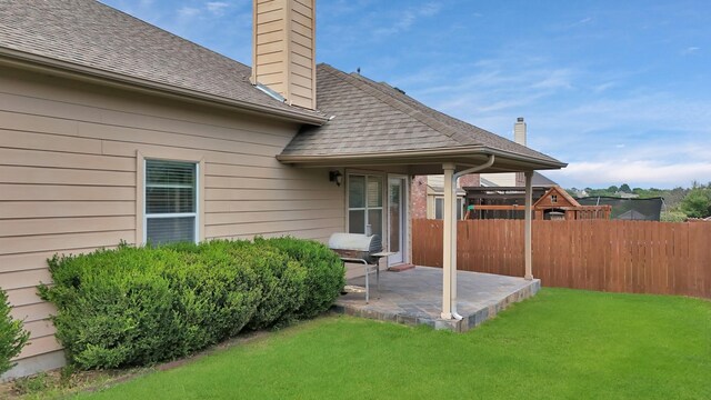 760 Red Elm Ln, Fort Worth, TX 76131 - rear view of property featuring a chimney, a patio area, and roof with shingles