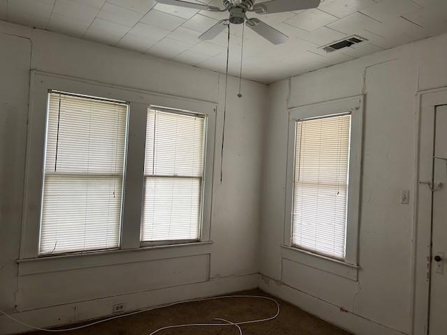 823 Centre, Dallas, TX 75208 - spare room featuring ceiling fan and plenty of natural light