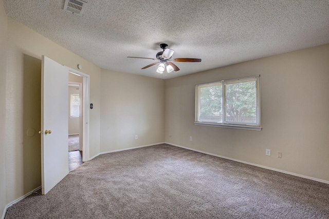 6729 Windwillow Dr, Fort Worth, TX 76137 - carpeted empty room featuring ceiling fan, a textured ceiling, and baseboards