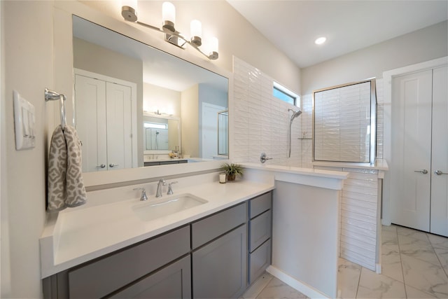 3493 Hollow Pine Dr, Frisco, TX 75033 - bathroom featuring vanity, marble look tile flooring, and recessed lighting