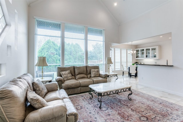 5916 Broadmoor Dr, Plano, TX 75093 - living area with a chandelier, high vaulted ceiling, light tile patterned flooring, baseboards, and recessed lighting