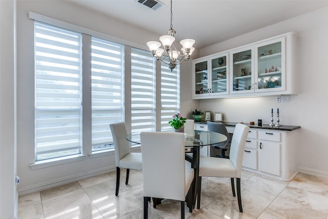 5916 Broadmoor Dr, Plano, TX 75093 - dining area with plenty of natural light, a chandelier, and baseboards