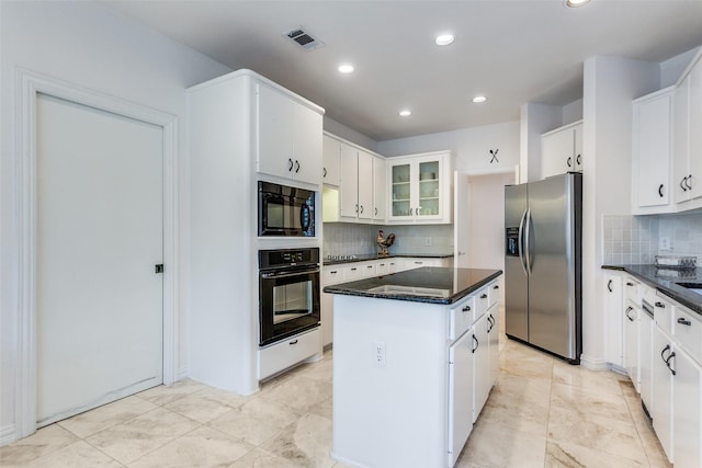 5916 Broadmoor Dr, Plano, TX 75093 - kitchen featuring black appliances, a center island, tasteful backsplash, recessed lighting, and white cabinets