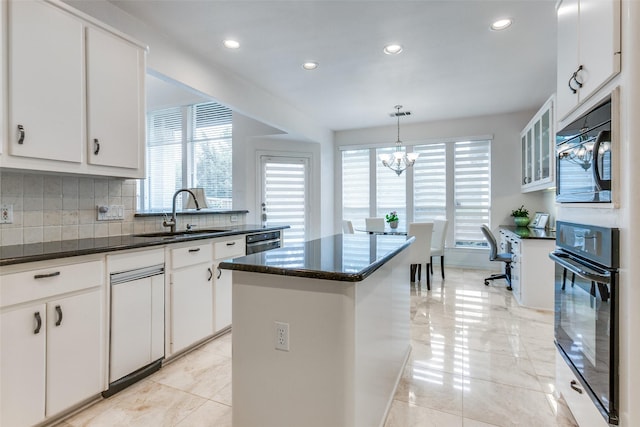 5916 Broadmoor Dr, Plano, TX 75093 - kitchen featuring a sink, black oven, plenty of natural light, backsplash, and recessed lighting