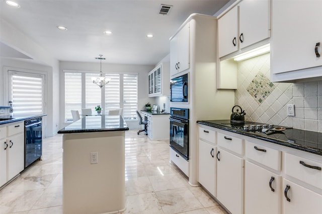5916 Broadmoor Dr, Plano, TX 75093 - kitchen featuring black appliances, a center island, tasteful backsplash, a chandelier, and hanging light fixtures