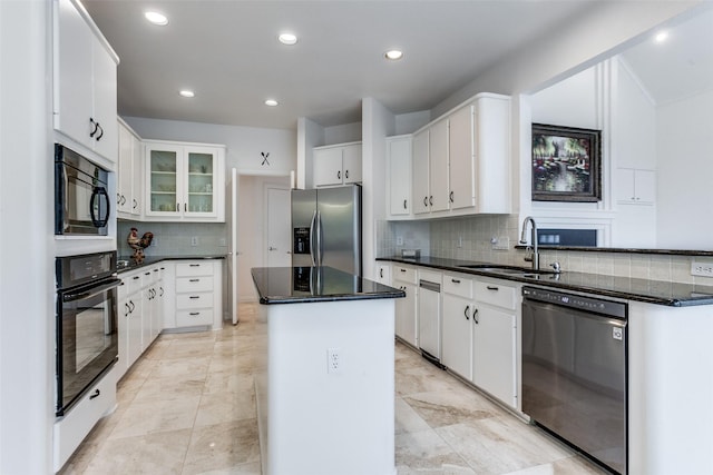 5916 Broadmoor Dr, Plano, TX 75093 - kitchen featuring black appliances, a sink, a center island, decorative backsplash, and white cabinets
