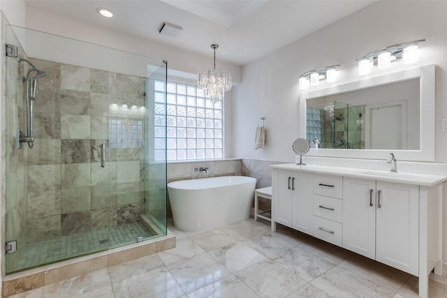 5916 Broadmoor Dr, Plano, TX 75093 - bathroom featuring vanity, a freestanding tub, a shower stall, a chandelier, and recessed lighting