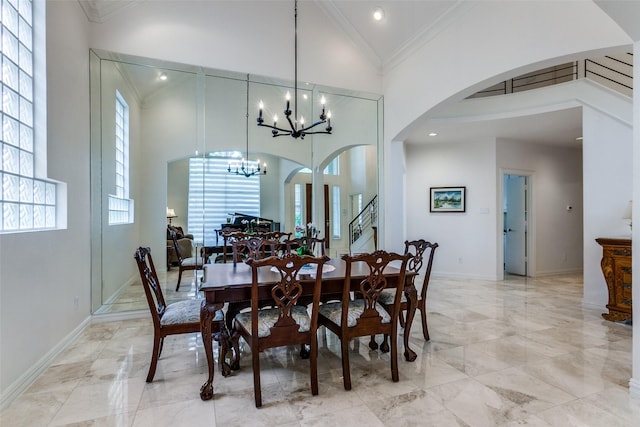 5916 Broadmoor Dr, Plano, TX 75093 - dining area featuring high vaulted ceiling, light marble finish flooring, arched walkways, a chandelier, and crown molding