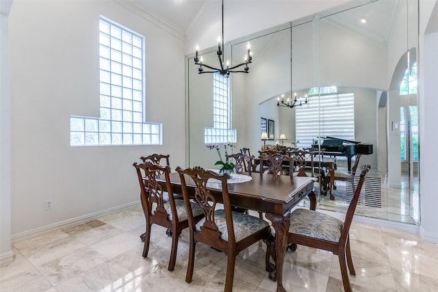 5916 Broadmoor Dr, Plano, TX 75093 - dining area featuring a chandelier, a high ceiling, ornamental molding, healthy amount of natural light, and baseboards