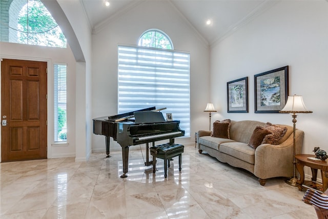 5916 Broadmoor Dr, Plano, TX 75093 - entryway featuring high vaulted ceiling, light marble finish flooring, crown molding, arched walkways, and baseboards