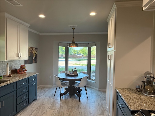 3417 Danbury Dr, Amarillo, TX 79109 - dining area with baseboards, recessed lighting, crown molding, and light marble finish floors