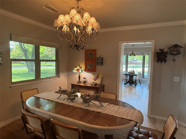 3417 Danbury Dr, Amarillo, TX 79109 - dining room featuring a chandelier, crown molding, and baseboards