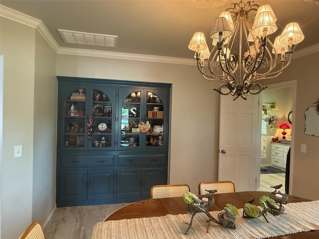 3417 Danbury Dr, Amarillo, TX 79109 - dining space with a chandelier, crown molding, light marble finish flooring, and baseboards