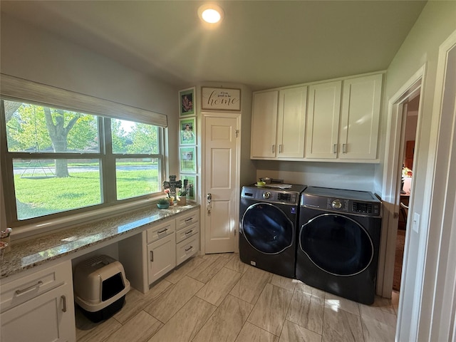 3417 Danbury Dr, Amarillo, TX 79109 - laundry area with washer and dryer and cabinet space