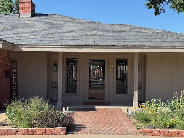 3417 Danbury Dr, Amarillo, TX 79109 - property entrance with a chimney and covered porch