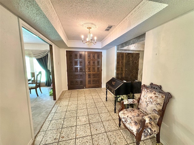 1107 Rock Springs Rd, Duncanville, TX 75137 - entrance foyer with a raised ceiling, a chandelier, a textured ceiling, and tile patterned floors
