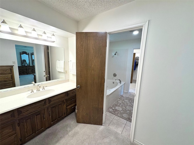1107 Rock Springs Rd, Duncanville, TX 75137 - bathroom featuring a bath, vanity, connected bathroom, a textured ceiling, and tile patterned floors