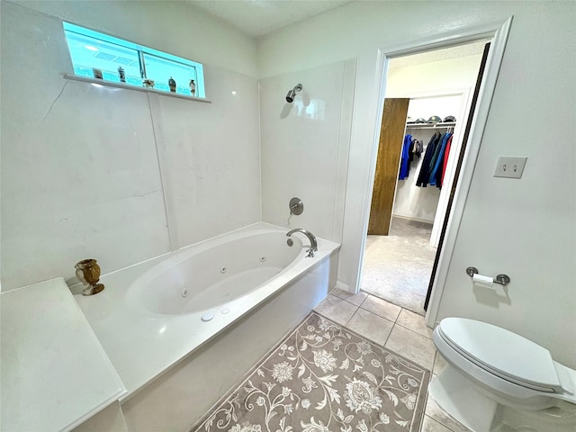 1107 Rock Springs Rd, Duncanville, TX 75137 - bathroom featuring tile patterned floors, a spacious closet, and a combined bath / shower with jetted tub