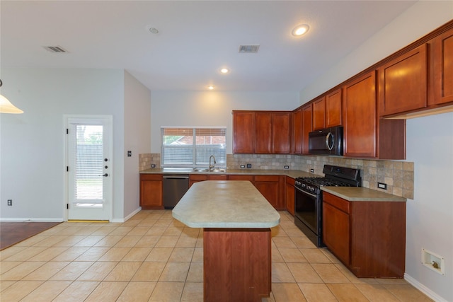 6506 Bunker Hill Ct, Rowlett, TX 75089 - kitchen with black appliances, backsplash, light countertops, a center island, and light tile patterned flooring