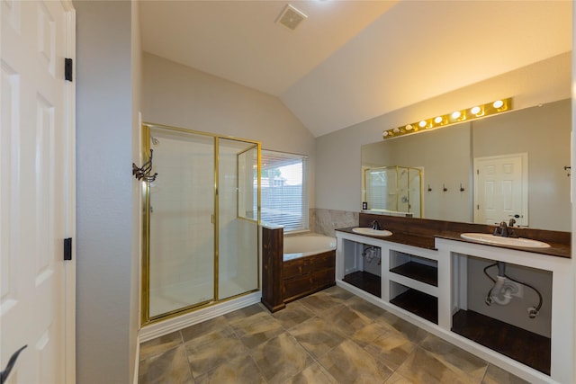 6506 Bunker Hill Ct, Rowlett, TX 75089 - bathroom featuring a bath, a shower stall, double vanity, lofted ceiling, and tile patterned flooring