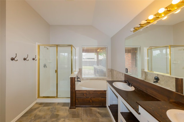 6506 Bunker Hill Ct, Rowlett, TX 75089 - full bathroom featuring a shower stall, a bath, double vanity, and lofted ceiling