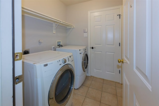 6506 Bunker Hill Ct, Rowlett, TX 75089 - washroom with independent washer and dryer and light tile patterned floors