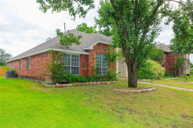 6506 Bunker Hill Ct, Rowlett, TX 75089 - view of front of house with a front lawn, brick siding, and roof with shingles