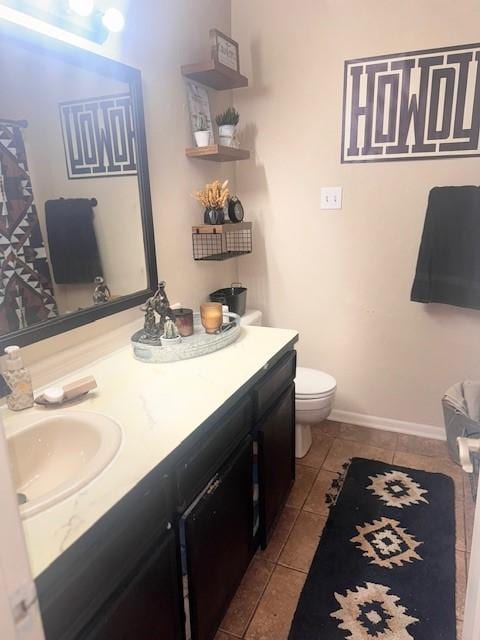 226 Colonial Cir, Athens, TX 75751 - full bathroom with toilet, vanity, tile patterned flooring, and baseboards