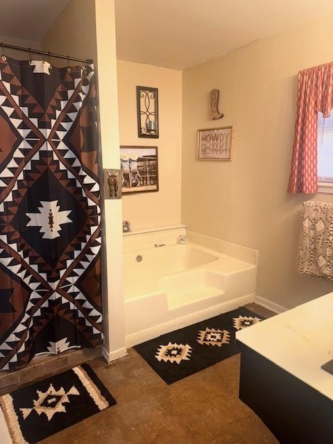 226 Colonial Cir, Athens, TX 75751 - full bathroom with a bath, vanity, baseboards, and a shower with curtain