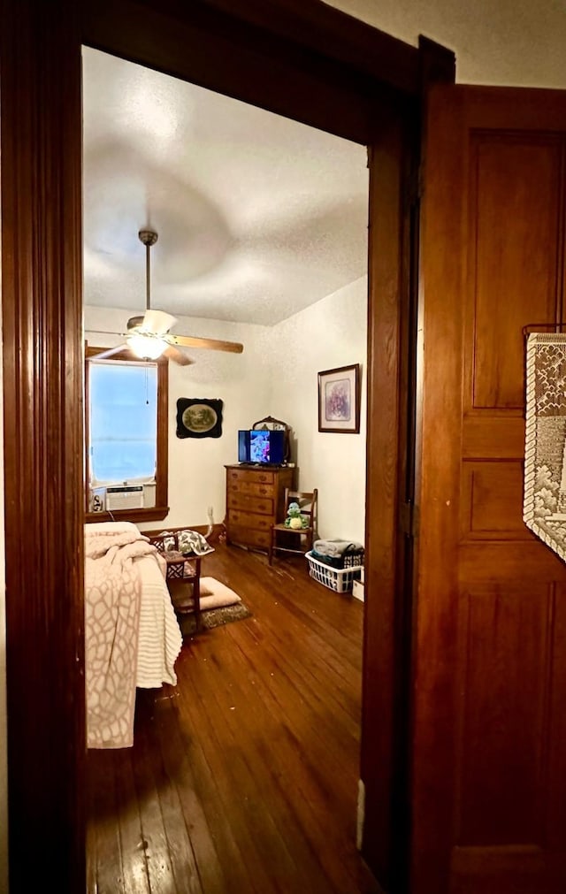 618 W Chestnut St, Denison, TX 75020 - bedroom featuring wood-type flooring, ceiling fan, and cooling unit