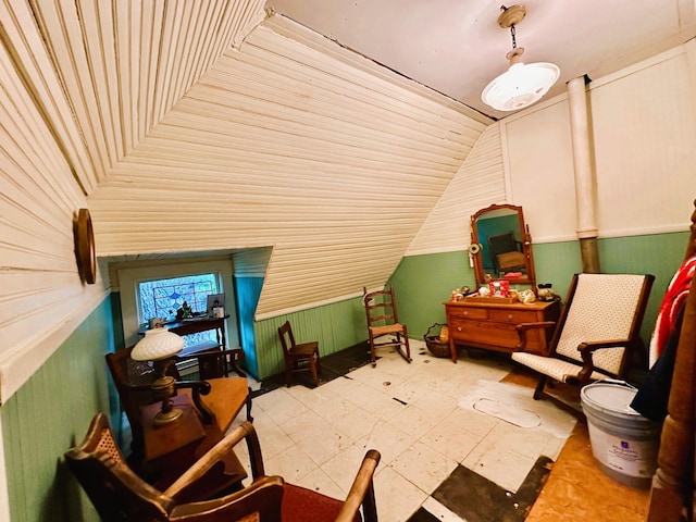 618 W Chestnut St, Denison, TX 75020 - bonus room featuring lofted ceiling and wood walls