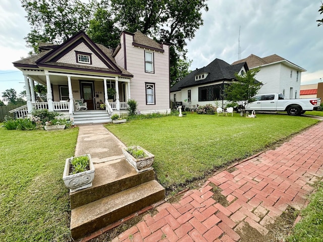 618 W Chestnut St, Denison, TX 75020 - victorian home featuring a porch and a front lawn