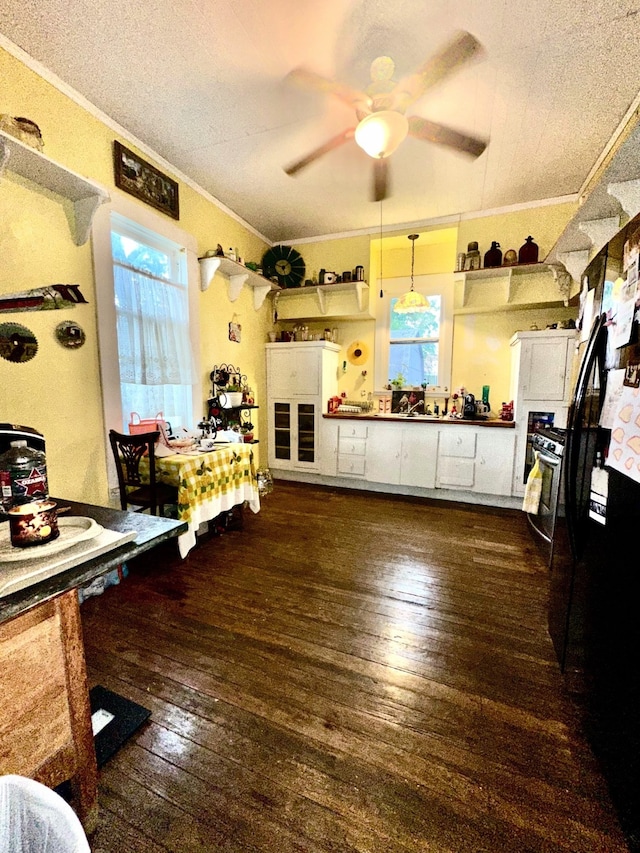 618 W Chestnut St, Denison, TX 75020 - kitchen featuring crown molding, a ceiling fan, dark wood finished floors, white cabinetry, and open shelves