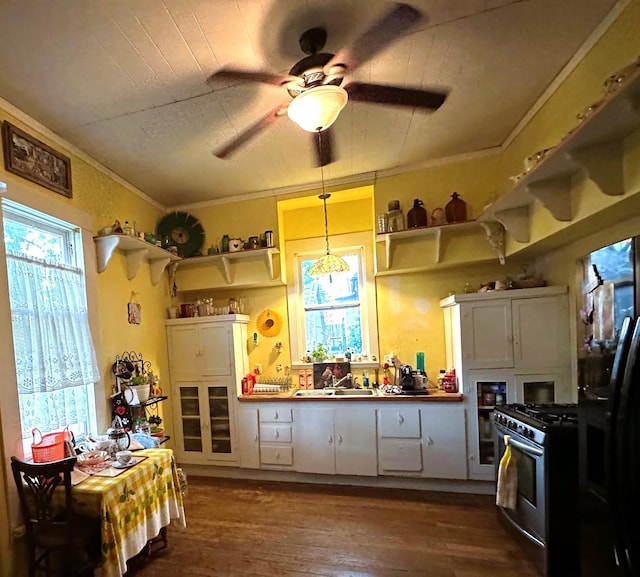 618 W Chestnut St, Denison, TX 75020 - kitchen featuring open shelves, gas stove, dark wood finished floors, and ornamental molding