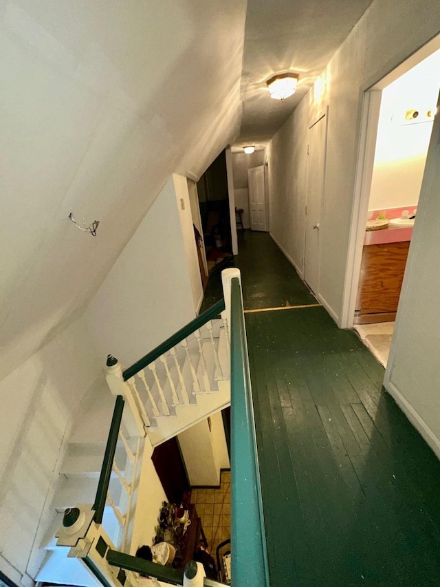 618 W Chestnut St, Denison, TX 75020 - hallway featuring wood-type flooring, lofted ceiling, stairs, and baseboards